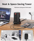 12 Outlet Surge Protector Power Strip Tower with 10 Ft Extension Cord and 4 USB Ports on office desk setup.