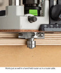 Close-up of Top Shelf Rabbeting Router Bit Kit with twin ball bearing base on plywood, ideal for precise routing tasks.