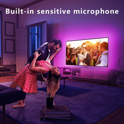 Couple dancing in living room with purple glow from 8.2ft USB RGB LED TV Backlight Strip For 32 To 40 Inch TVs With Remote Built In Mic Music Sync Bluetooth App Control Dope Gaming Bedroom Mood Lighting For HDTV