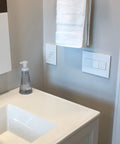 Bathroom with installed Adorne 15 Amp Tamper-Resistant Outlet With Matching Wall Plate, 12 Pack, Gloss White Finish, UL Listed.