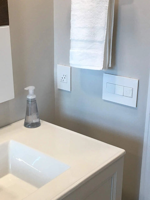 Bathroom with installed Adorne 15 Amp Tamper-Resistant Outlet With Matching Wall Plate, 12 Pack, Gloss White Finish, UL Listed.