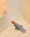 Installed heavy duty push to open door latches for RV cabinets and closets, non magnetic touch release, gray, wood surface