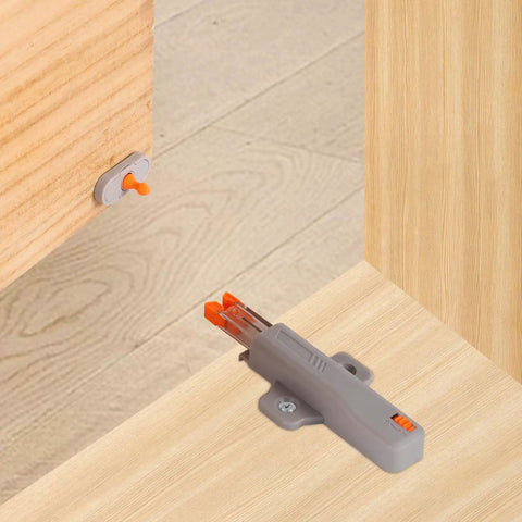 Installed heavy duty push to open door latches for RV cabinets and closets, non magnetic touch release, gray, wood surface