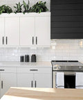 Modern kitchen with white cabinets featuring the 30 Pack 5 Inch Matte Black Cabinet Handles For Kitchen Cupboard And Drawer Pulls Hardware