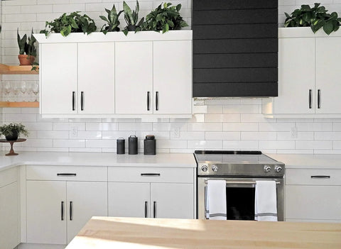 Modern kitchen with white cabinets featuring the 30 Pack 5 Inch Matte Black Cabinet Handles For Kitchen Cupboard And Drawer Pulls Hardware