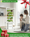 Hydroponic Tower Garden System With Full Spectrum Grow Lights For Indoor And Outdoor Use 5 Tier Vertical Garden With 25 Pods in a kitchen with a mother and child
