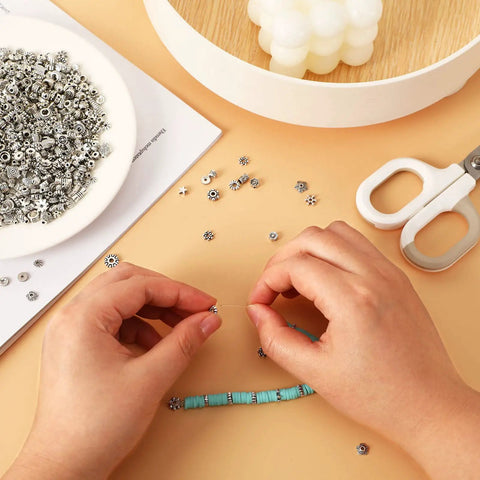 Hands crafting bracelet with Tibetan Silver Spacer Beads 1000 Pieces Metal Beads For Jewelry Making Bracelet And Necklace Craft Supplies