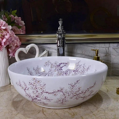 Top Shelf Above Counter Vessel Sink For Modern Bathroom Vanity High Gloss Art Porcelain Wash Basin Built Tough Ceramic Craftsmanship And No Sweat Install 40X15 Cm Slick Finish, elegant oval sink with floral design.