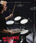 Man playing Electric Drum Set With Tower Kick And Dual Zone Mesh Pads For Real Feel And Gig Ready Tone 10 Inch Snare 10 Inch Dual Zone Cymbals