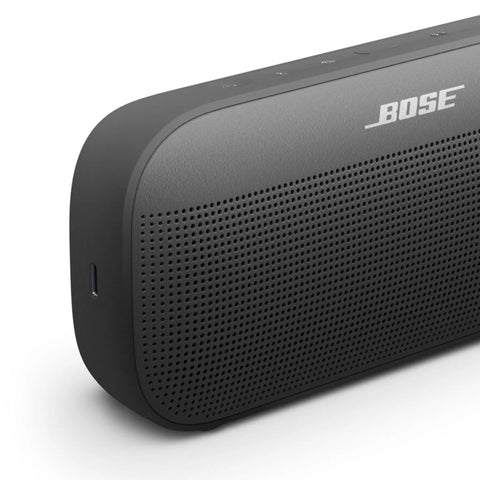 SoundLink Flex Bluetooth Speaker Second Gen Portable Outdoor Party Buddy With Hi Fi Audio Waterproof And Dustproof USB C Power Up To 12 Hours Battery Life Black, close-up view of speaker's front side and grill