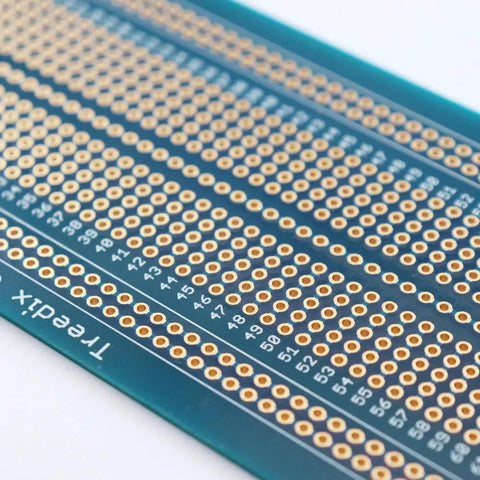 Close-up of Universal Solderable Breadboard PCB Prototype Shield Double Sided Board With Tinned Gold Plated Holes for prototyping