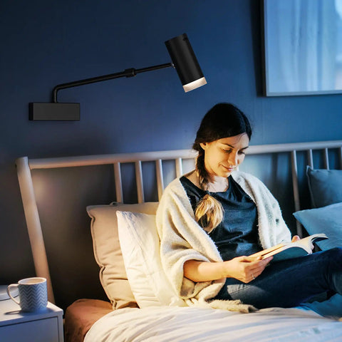 Battery Operated Picture Light With Telescoping Arm, Adjustable 7.8 To 13.8 Inches, Silver Finish, illuminating bedroom over bed.