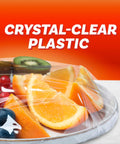 Ridiculously Handy Clear Plastic Wrap for Kitchen Storage covering fruit on a plate, extra long roll with easy dispense.