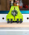 BOW FencePRO FP4 featherboard for table saws, neon-green body with EVA black teeth mounted on a fence