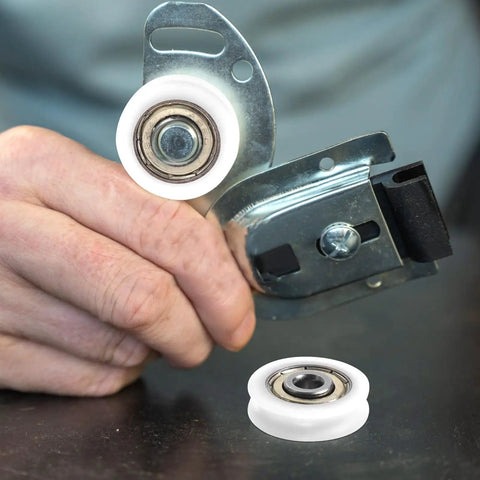 Smooth 1.5 Inch Small Ball Bearing Rollers With Deep Groove Steel Design for skateboard wheels held in hand, featuring durable nylon.