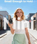 Woman holding Tiny USB Desk Fan You Can Take Anywhere With Quiet 4 Speed Rechargeable Battery Powered Personal Fan, street background.