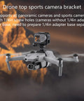Drone with top mount camera bracket using 1/4 inch screw, non-slip pads, adjustable straps for cameras, capturing aerial footage.