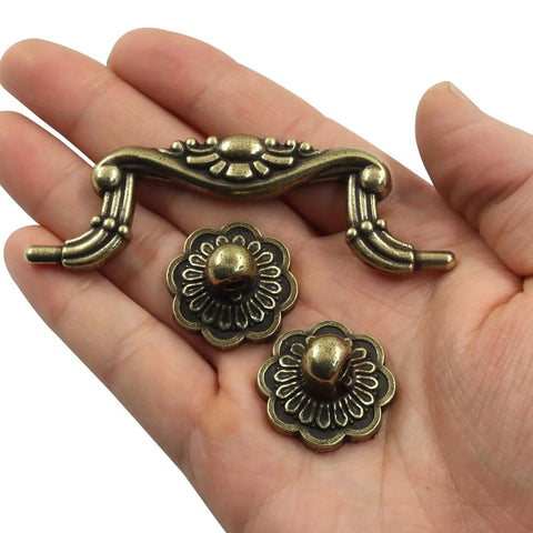 Vintage Drop Bail Cabinet Pulls 3 Inch Hole Centers 6 Piece Set Antique Bronze Finish in hand, showing details and design.