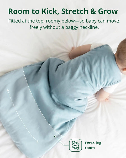 Baby in blue Ultra Soft Bamboo Viscose Baby Sleep Sack For 6 To 18 Months, 1.0 Tog, Two Pack, Cozy Wearable Blanket on bed