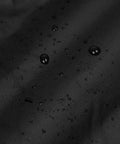 Close-up of 600D black fabric with water droplets on Waterproof Folding Wagon Cover For Outdoor Carts And Garden Utility Wagons