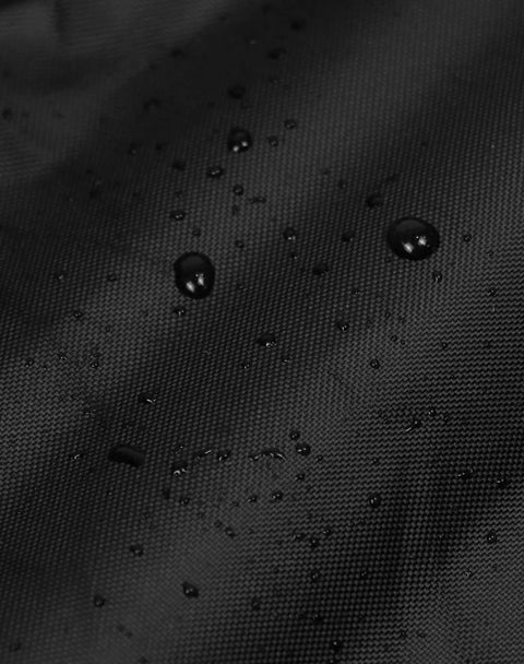 Close-up of 600D black fabric with water droplets on Waterproof Folding Wagon Cover For Outdoor Carts And Garden Utility Wagons