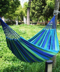 Durable Portable Cotton Hammock For Camping And Outdoor Indoor Use With Hanging Ropes Carrying Bag Blue Large in a garden