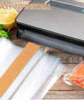 Two Piece Wide Flat Ribbon Heater Strip Replacement For Sealing Machines on a wooden surface with sealing bags and salmon.