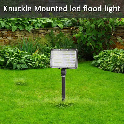 Bright 150W LED Outdoor Flood Light With 21000 Lumens, 5000K Daylight, mounted on a knuckle in a garden setting