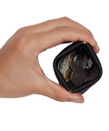Smooth Vintage Black Leather Squeeze Coin Purse With Heavy Duty Spring Frame, compact change holder filled with coins.