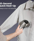 Person using Magic 1 Vacuum Steamer For Clothes With 2300Pa Fabric Grip One Handed Operation On The Go Handheld Garment Steamer on shirt
