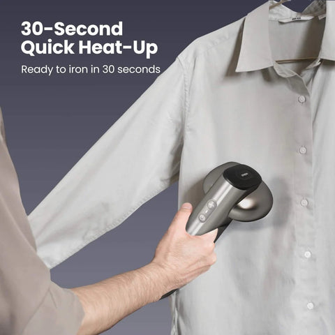 Person using Magic 1 Vacuum Steamer For Clothes With 2300Pa Fabric Grip One Handed Operation On The Go Handheld Garment Steamer on shirt