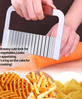 Zorveiio stainless steel crinkle cutter with wooden handle used to slice carrot on cutting board