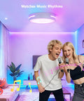 Two people singing with a colorful LED ceiling light, showcasing music-synchronized lighting in a modern living room.