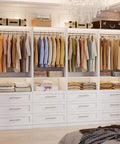 Premium Modular Closet System With Twelve Roomy Drawers Expands Effortlessly From Eight To Twenty One Feet with hanging clothes and neatly stacked towels.