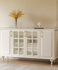Elegant white cabinet with glass doors, featuring Gold Cabinet Pulls For Cabinets And Kitchen Top Notch 25 Pack.