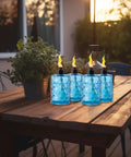 4 Pack Glass Table Top Torches With Wick And Cap, Multicolor Citronella Lanterns For Outdoor Yard Patio Deck Garden, Refillable Flame Light Torches on wooden table