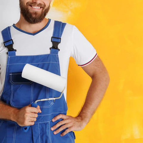 Pro Sponge Paint Roller Brush Head For Wall Edges And Trim Work With Grip Tight Ergonomic Handle displayed by a painter.