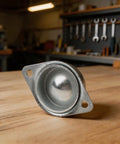 Heavy Duty Galvanized Steel Ball Wheel Casters Delivering Rock Solid Sixty Six Pound Capacity With Smooth 360 Degree Flex Swivel Action For Effortless Heavy Rolling On Shop Carts And Dollies, close-up of single caster wheel