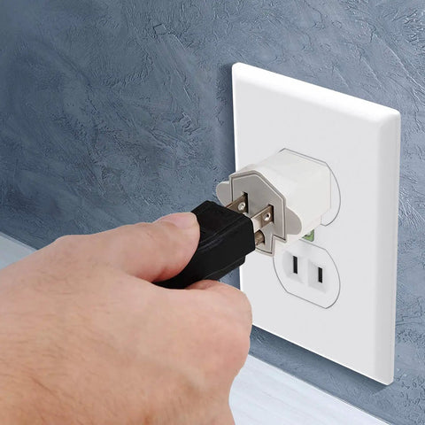 Hand plugging into a wall outlet using 2 Pack ETL Listed 3-Prong To 2-Prong Adapter, Fireproof PBT Material, 125V 15A Converter