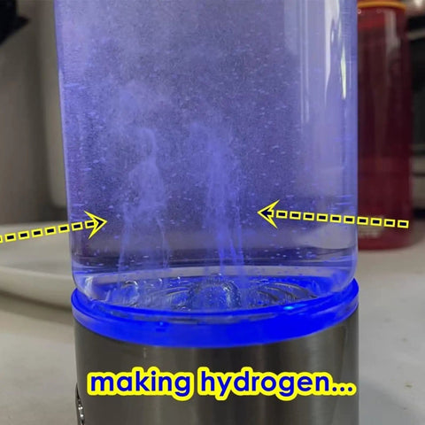 Image of a hydrogen water generator bottle creating hydrogen, visible through a clear container with blue lighting.
