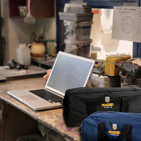 Two Tote Style Tool Bags Set For Pros And DIYers Includes Small And Medium Organizers on workshop table with laptop