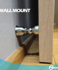 Ultra Short Magnetic Door Stop For Holding Doors Open with stainless steel catch, wall-mounted on a wooden floor.