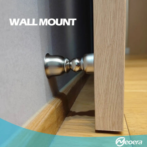 Ultra Short Magnetic Door Stop For Holding Doors Open with stainless steel catch, wall-mounted on a wooden floor.