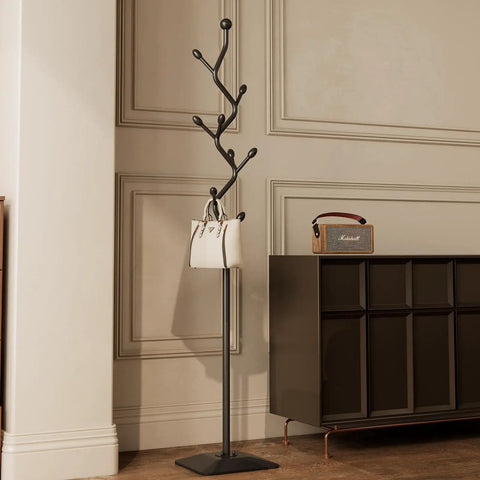 Tree Shaped Coat Rack With Eight Hooks Heavy Duty Freestanding Metal Coat Tree On Cast Iron Base in black finish in entryway.