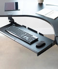 Rock Solid Slide Out Keyboard Tray For Corner Desk Effortless Gliding Computer Drawer With Swivel Clamps Black, shown mounted with keyboard and mouse.