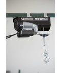 Strongway 1100 Lb Electric Cable Hoist with 2200 Lb Double Line Capacity for Garage Use, showcasing motor and hook.