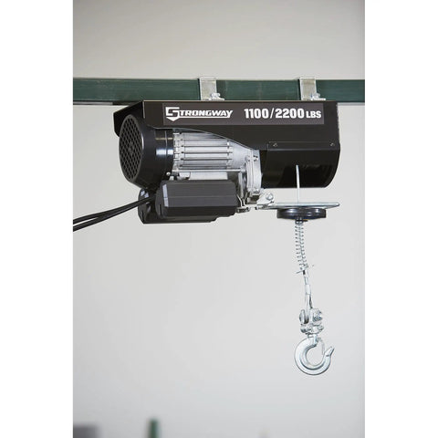 Strongway 1100 Lb Electric Cable Hoist with 2200 Lb Double Line Capacity for Garage Use, showcasing motor and hook.