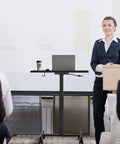 Business presentation featuring mobile standing desk on wheels with height adjustable range from 28.5 to 42.5 inches rolling workstation.