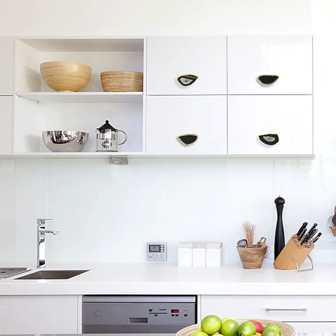 Total Game Changer Natural Black Agate Cabinet Knobs With Heavy Duty Brass Mounting And Polished Gold Plated Drawer Pulls Set Of Four in a modern kitchen.