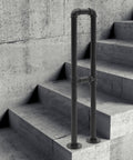 U Shaped Floor Standing Galvanized Steel Handrail on concrete stairs, providing stability and non-slip grip for home use.
